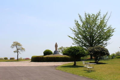 Statue in park against clear sky