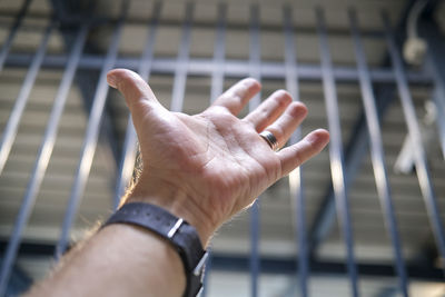 Close-up of man hand holding cigarette