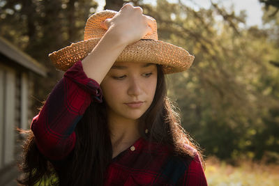 Close-up of teenage girl wearing hat