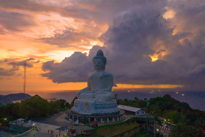 Statue against sky during sunset