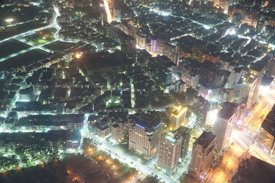 Aerial view of illuminated city at night