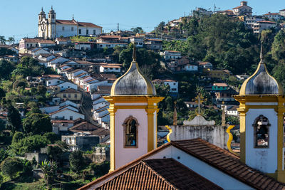 Buildings in city against sky