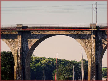 Low angle view of bridge against clear sky