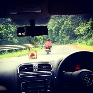 Cropped image of car on road