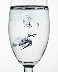 Close-up of glass against white background