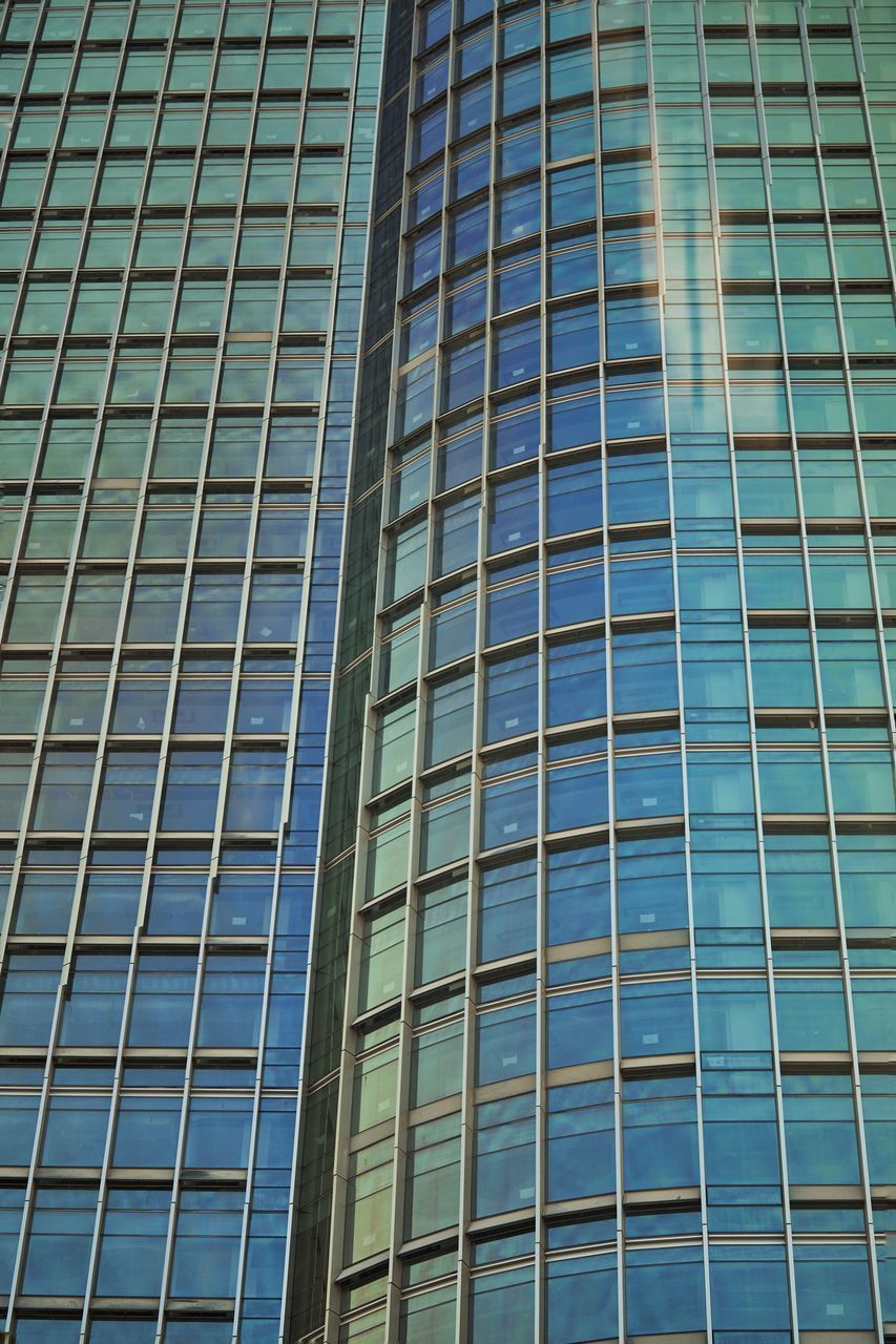 LOW ANGLE VIEW OF GLASS BUILDING