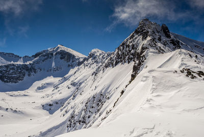 Scenic view of snowcapped mountains. 