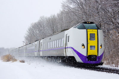 Train on snow covered railroad track
