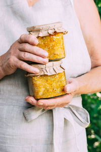 Midsection of woman holding food