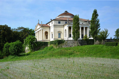 Facade of historic house against sky