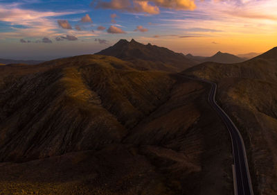 Scenic view of mountains against sky during sunset