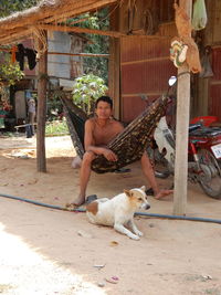 Full length of man with dog outdoors