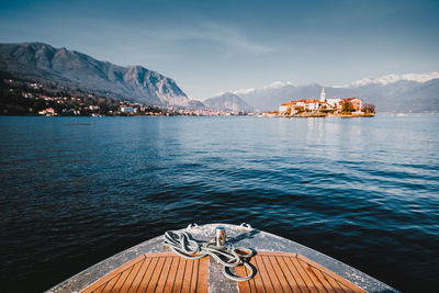 Closeup on a bow of tourist boat while surfing lake maggiore with the borromee islands