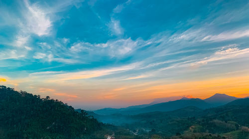 Scenic view of mountains against sky during sunset