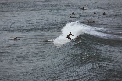 People surfing on wave