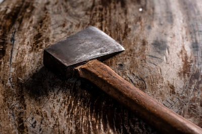 An ax on a wooden table