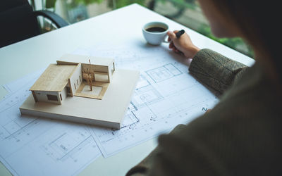 High angle view of person working on table