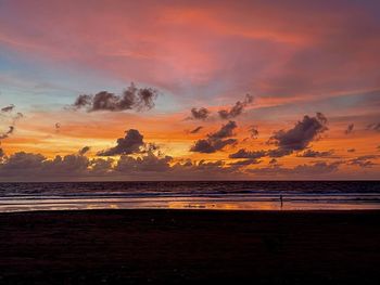 Scenic view of beach against sky during sunset