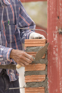 Close-up of man working on wood