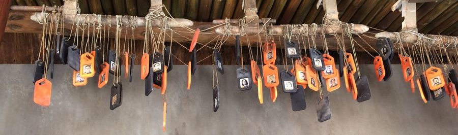 Close-up of clothes hanging on wood