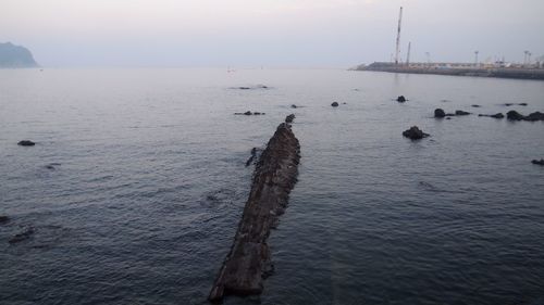 Scenic view of sea against sky at sunset