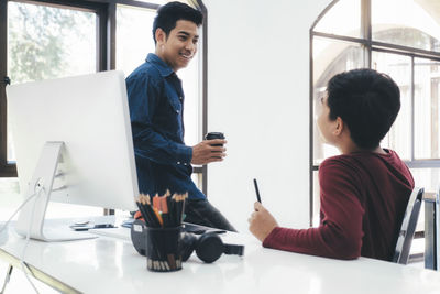 Businessmen talking in office