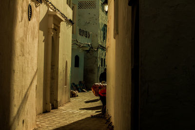 Narrow alley amidst buildings in city