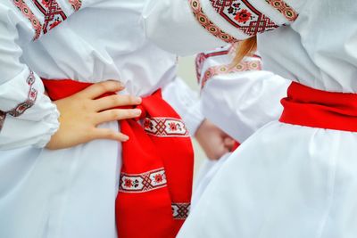 Midsection of women in traditional clothing