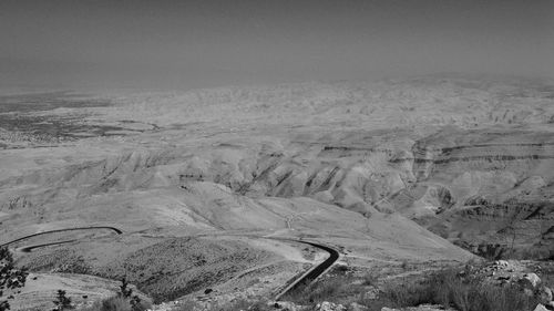 Scenic view of mountains in desert against sky