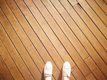 Low section of person standing on deck