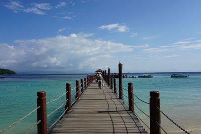 Pier over sea against sky