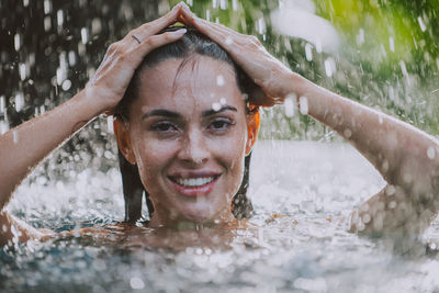 Young woman swimming in pool