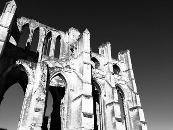 Low angle view of old building against clear sky