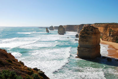 Scenic view of sea against clear blue sky