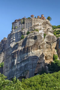 Low angle view of rock formations against sky