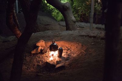 High angle view of kettle on fire at campsite