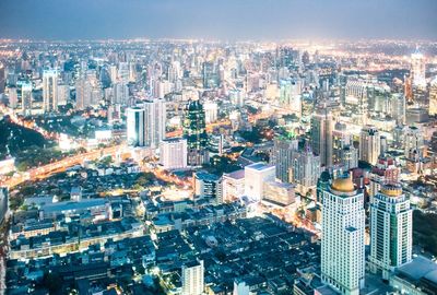 Aerial view of illuminated cityscape at night