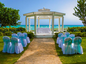 Gazebo in park against clear blue sky