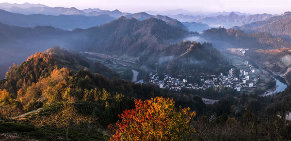 High angle view of trees and mountains against sky