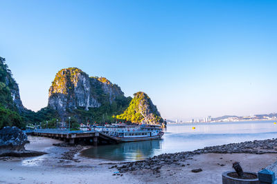 Scenic view of bay against clear sky
