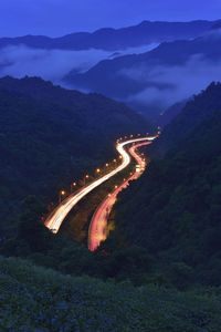 High angle view of light trails on road