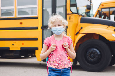 Girl standing in bus