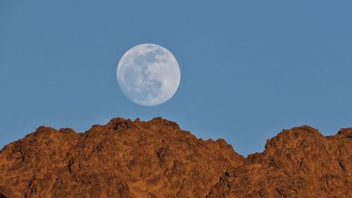 Low angle view of moon against sky