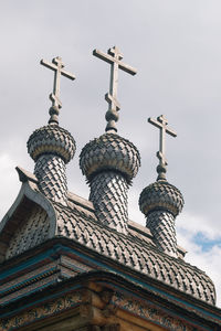 Low angle view of bell tower against sky