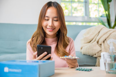 Young woman using mobile phone