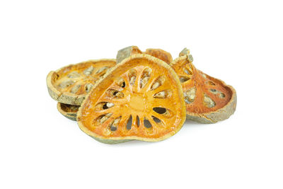 Close-up of orange slice against white background