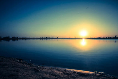 Scenic view of calm sea at sunset