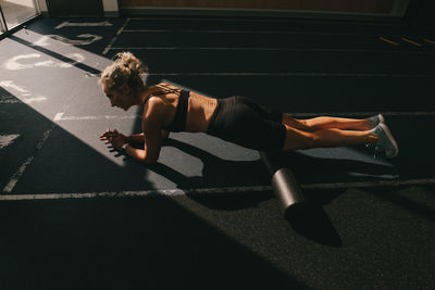 High angle view of woman relaxing on floor at home