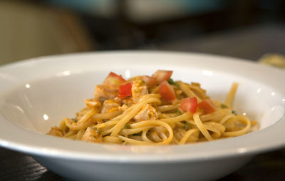 Close-up of spaghetti served in bowl on table