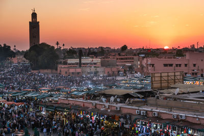High angle view of crowd at market during sunset